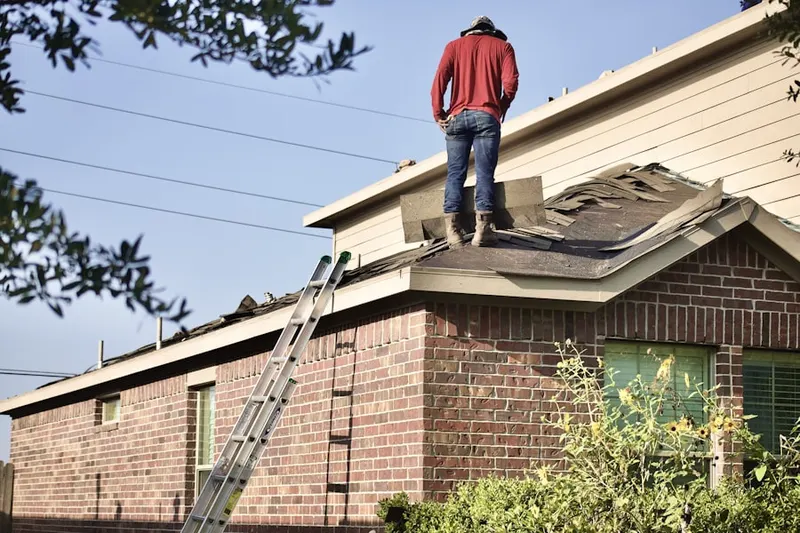 Professional roofer working on a residential roof in Greencastle